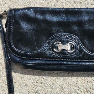 Michael Kors Black leather wristlet. Silver buckle GUC Little Black Dress Ready!